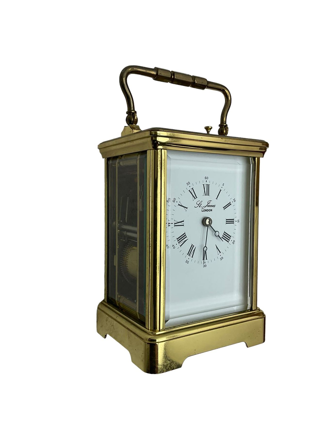 8-day French 20th century corniche carriage clock with a striking movement and repeat work, white enamel dial with Roman numerals, minute track and steel moon hands, dial inscribed St James, London. With a jewelled lever escapement, striking the hours and half hours on a coiled gong. 
