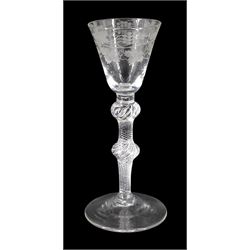 Mid 18th century wine glass, the funnel bowl engraved with fruiting vines upon a single series air twist double knopped stem and conical foot, H16.5cm