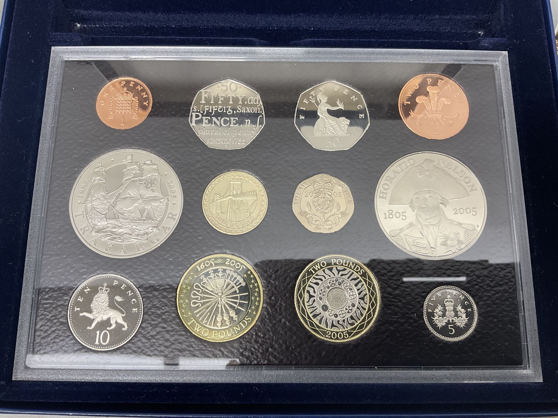 The Royal Mint United Kingdom 2005 proof coin set, with certificate, 2009 'Henry VIII' brilliant uncirculated fine pound coin, 2010 brilliant uncirculated coin collection, 2015 'The Fourth and Fifth Circulating Coinage Portrait Collection', and 'Farewell and Nations of the Crown UK' one pound brilliant uncirculated two coin set, all cased or in card folders