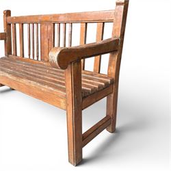 20th century teak cricket bench featuring a central splat with moulded cricket bat and ball motif flanked by stylised wicket spindles, over a slatted seat and square supports