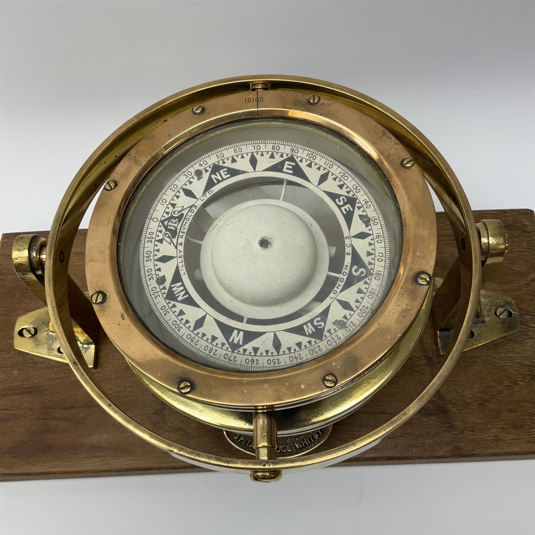 Lilley & Reynolds Ltd. ship's brass cased compass no.16100 D18.5cm with gimbal mount, fitted on an oblong hardwood base bearing brass plaque ' J.N. Lowther & Co. Ltd. Boat Builders Spital Bridge Whitby' L43cm