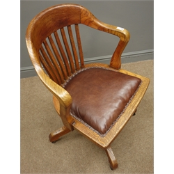  Early 20th century oak swivel office armchair, leather upholstered seat, splayed supports, brass plaque 'IBR 1631'  
