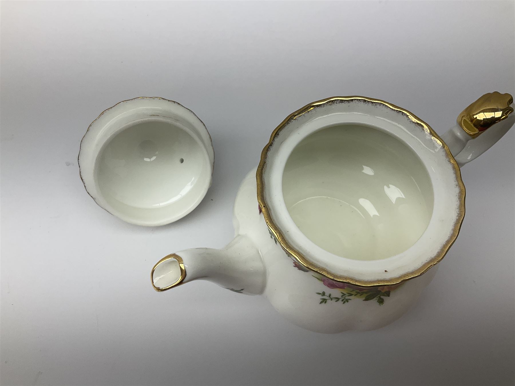 Royal Albert Old Country Roses pattern tea set, comprising teapot, coffee pot, six teacups and six saucers, five side plates, further teacup with joined saucer and side plate, open sucrier, milk jug, cake plate, and preserve pot and cover, together with Royal Albert Jubilee Rose pattern sauce boat and stand, and Royal Albert Lavender Rose pattern cake stand. 