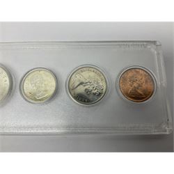 South Africa 1897 one shilling, 1967 one rand, Ireland 1928 two shillings and sixpence, Netherlands 1930 two and a half gulden, two Queen Elizabeth II Canada one dollar coins dated 1958 and 1964, 1967 six coin set in plastic holder etc