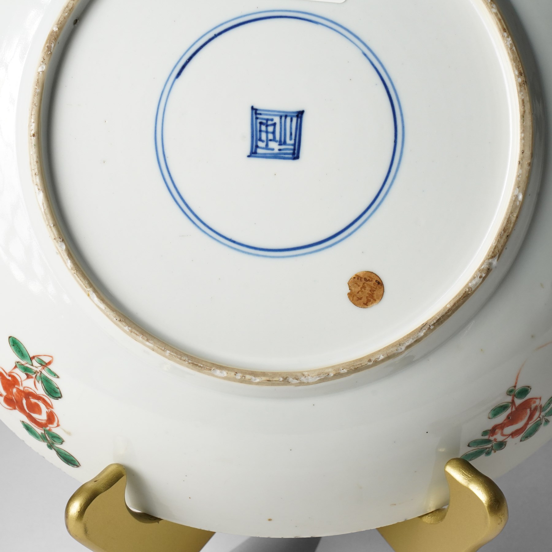 Chinese powder blue ground famille verte charger, possibly Kangxi, decorated with a central cartouche enclosing two female figures, with smaller shaped panels enclosing lions and foliage, square seal mark in blue to base, D28cm