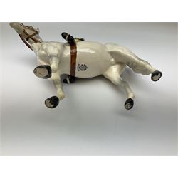 Beswick model of a huntswoman on grey horse model no 1730, and Beswick huntsman on brown horse model no 1501, both with printed mark beneath. 