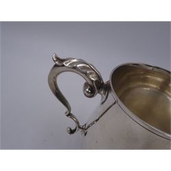 1920s silver christening mug, of plain waisted form with acanthus capped C scroll handle, upon circular stepped foot, hallmarked J B Chatterley & Sons Ltd, Birmingham 1920, H9.5cm