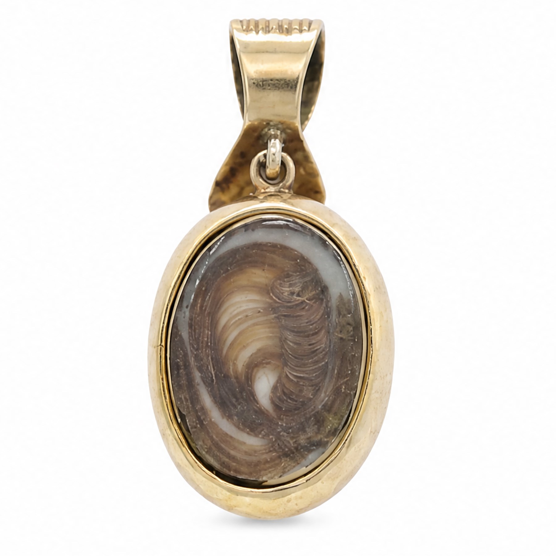 Victorian gold opal and ruby hairwork pendant / locket, the central flower head cluster set with a single oval cut opal surrounded by six oval cut rubies, the reverse with a glazed hairwork panel, engraved decoration throughout and ribbon shaped bale