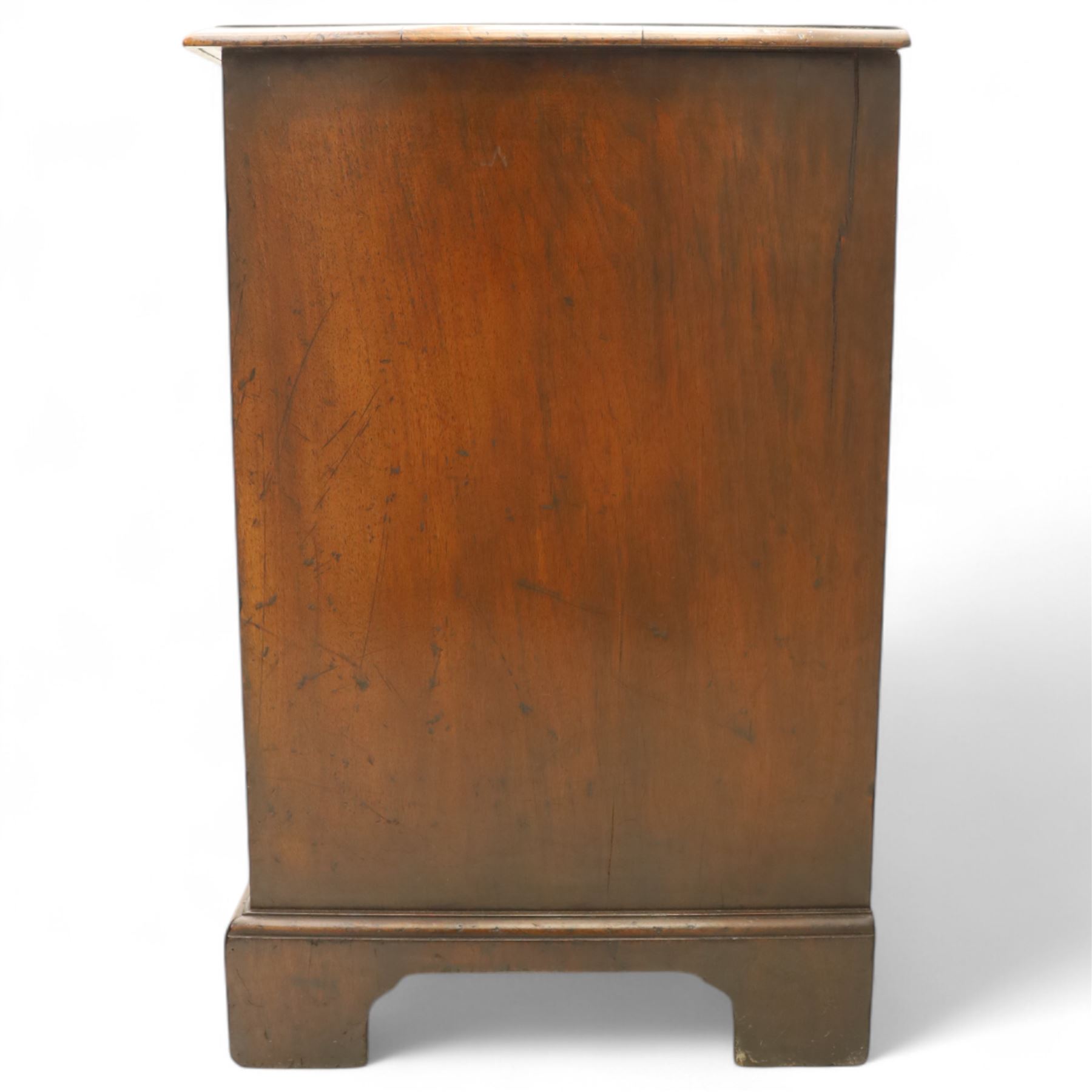 Small 19th century figured walnut chest of drawers, rectangular top with moulded edge over four graduating drawers with brass batwing handles, raised on bracket feet