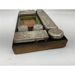 19th Century walnut dressing table box, with mother of pearl escutcheon and vacant ornate plaque and inlay decoration to hinged lid, the interior fitted with mirror and lift out tray with clear glass vanity jars, L30cm W22.5cm H17cm