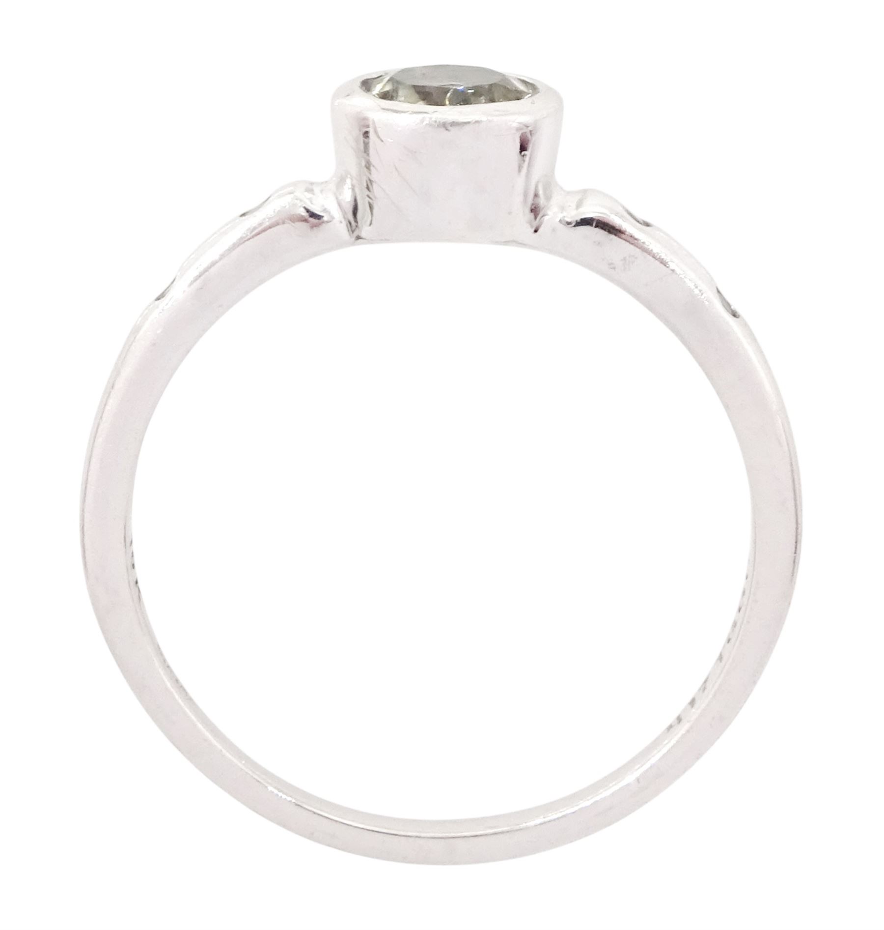 9ct white gold csarite and diamond ring, single round cut csarite with two rubover set diamonds set either side, Birmingham 2016