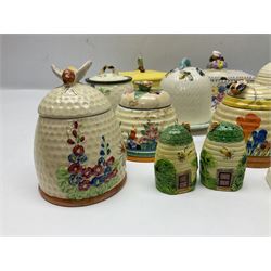 Clarice Cliff for Wilkinson Ltd Crocus Bizarre beehive honeypot painted in the Crocus pattern, together with two beehive Beswick honey pots, Poole square honey pot etc (14)