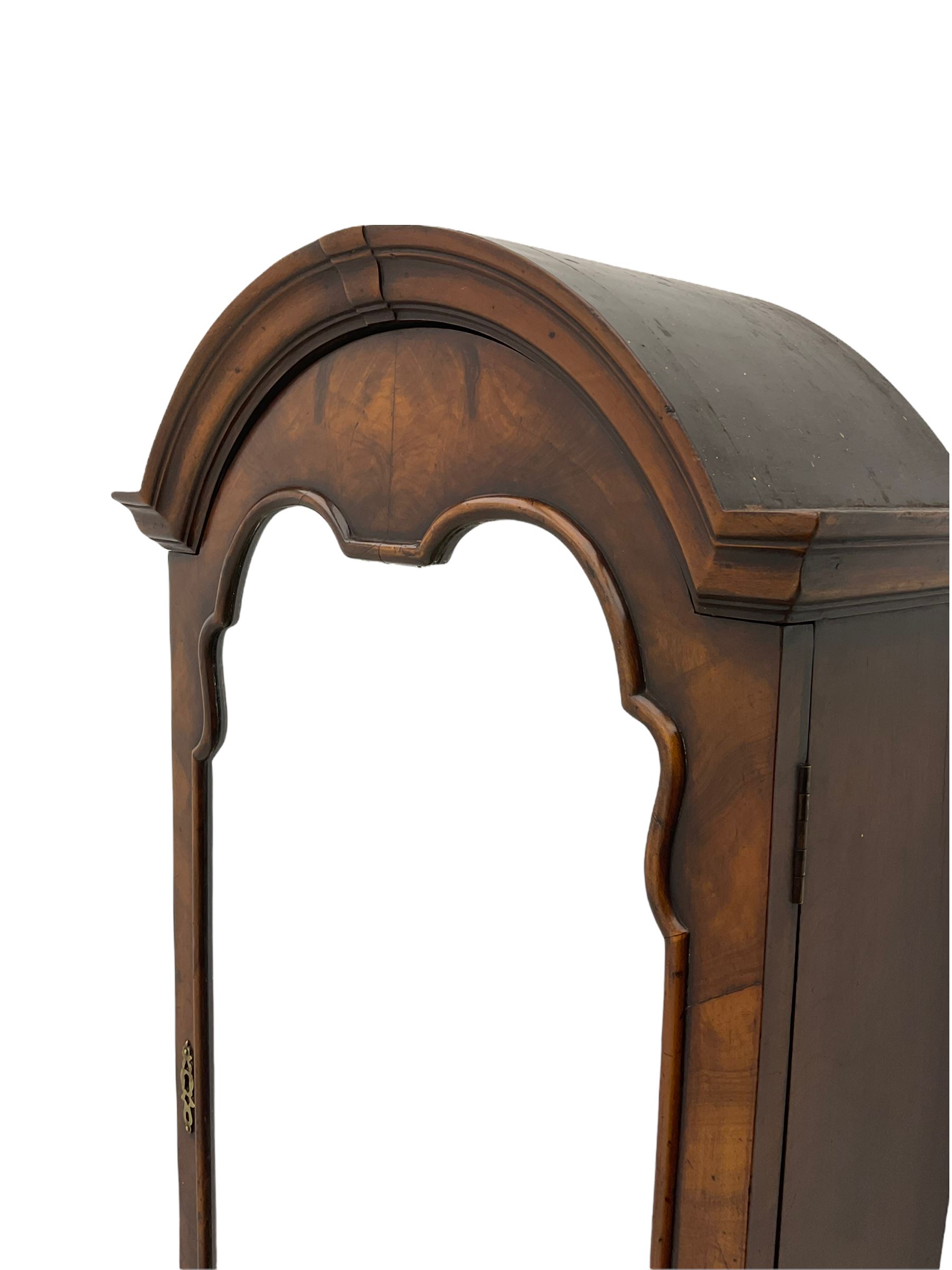 Small early 20th century Queen Anne style bookcase on bureau secretaire, the moulded arched pediment over mirrored door in shaped frame, the bureau fitted with fall front enclosing curved fitted interior, cushion moulded drawer over single drawer, on scroll and shell carved cabriole supports