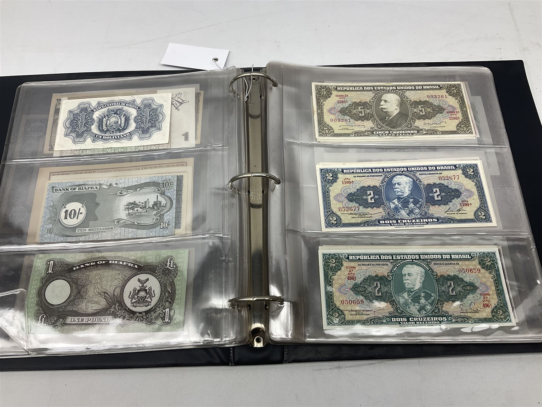 World banknotes, including Queen Elizabeth II The States of Jersey one pound 'DB202703', five pounds 'BB527762' and ten pounds 'AB651481', reserve bank of New Zealand two dollars '1L3 741894', King George V Straits Settlements one dollar 1st January 1935 'F/83 28924', various Bank of England notes etc, housed in two ring binder albums