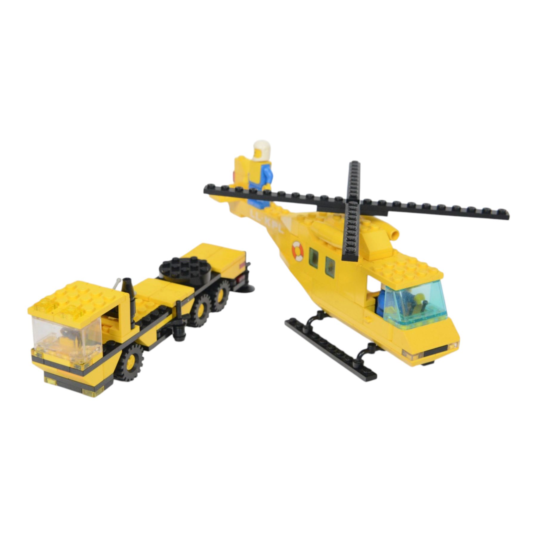 Eight vintage Lego Classic Town vehicles, comprising no. 6853 Coastal Cutter, no. 6359 Horse Trailer, no. 6693 Recycle Truck, no. 6361 Mobile Crane, no. 6340 Hook and Ladder, no. 6691 Red Cross Helicopter, no. 6341 Gas 'n' Go Flyer and no. 6697 Rescue Helicopter, all built with minifigures