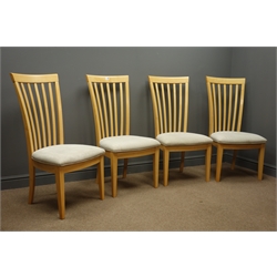  Four high back beech dining chairs, upholstered seats, square tapering supports.  