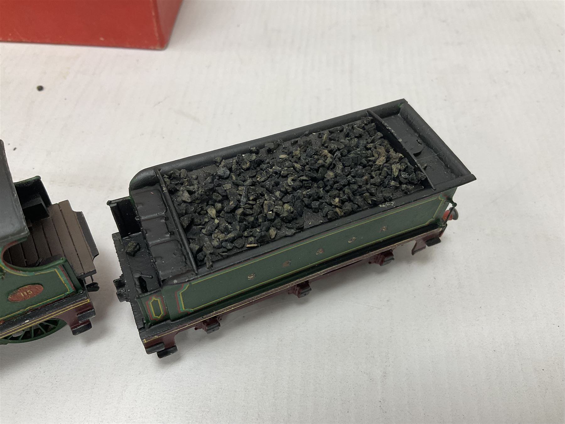 ‘00’ gauge - two kit built locomotive and tenders comprising SR Wainwright Class C 4-4-0 no.115 finished in SE&CR green; SR Wainwright Class D 4-4-0 no.31750 finished in BR black; both with Wills Finecast boxes (2) 