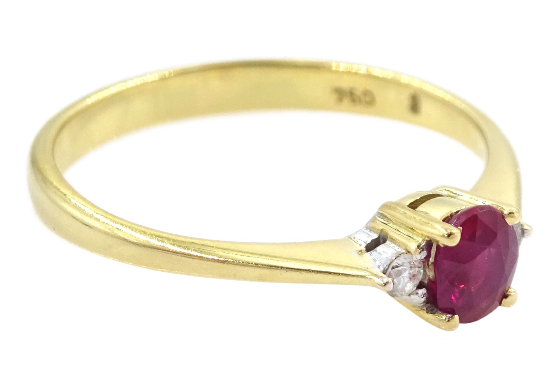 18ct gold three stone oval cut ruby and round brilliant cut diamond ring, stamped 750, ruby approx 0.30 carat