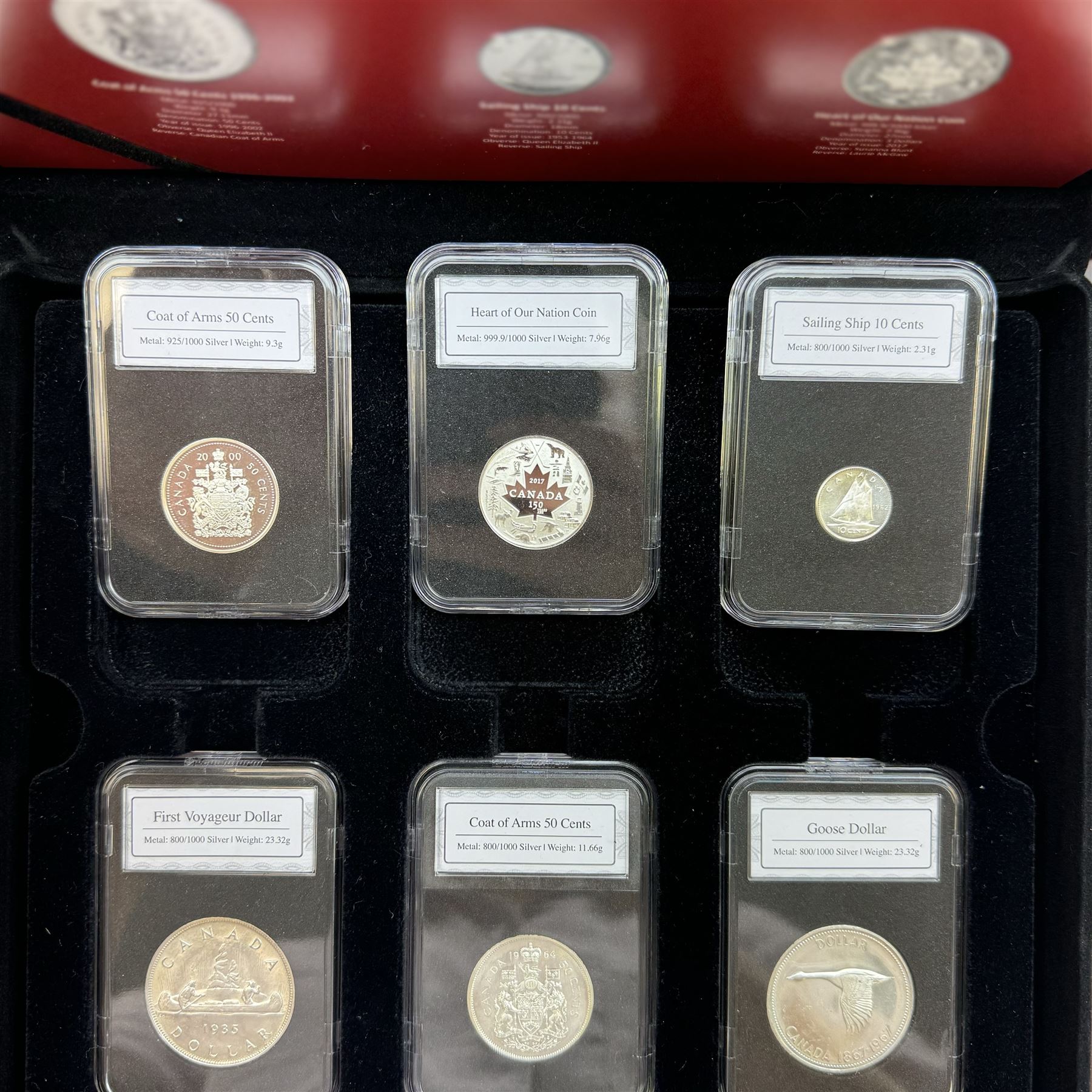 'The Canada 150 Historic Silver Coin Set', comprising King George V 1935 one dollar, Queen Elizabeth II 1962 ten cents, 1964 fifty cents, 1967 one dollar, 2000 fifty cents and 2017 three dollars, housed in a display case with information sheet