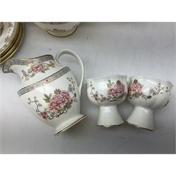 Royal Doulton Canton pattern tea and dinner wares comprising teapot, milk jug, twin handled lidded sucrier, cake plate, six dinner plates, six side plates, five smaller plates, five saucers and pair of candlestick holders, together with Sevres clear glass decanter with faceted sides and stopper, all with marks beneath