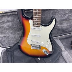 Fender style sunburst electric guitar with manuscript mark 'Zenta Stratocaster 1963' L97cm; in hard carrying case; another similar unmarked sunburst electric guitar; in gig bag; and Fender Frontman Amplifier, serial no.M473406 (3)