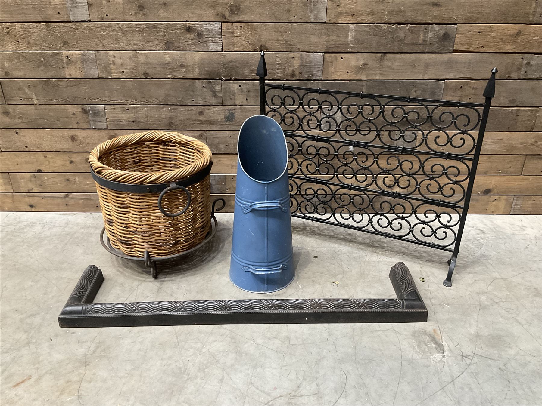 Black painted wrought iron fire guard , wicker log basket with stand, coal bucket and a fire kerb (4)