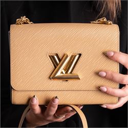 Louis Vuitton - ‘Twist’ MM Bag, the model introduced for the Cruise 2015 collection under Nicolas Ghesquière, in structured beige Epi cow hide leather with black sides, with gold-tone signature LV monogram twist-lock fastening and chain carrying handle, with detachable flat leather shoulder or crossbody strap, unused with original box and dust bag