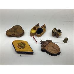 Collection of wooden sewing accessories, to include olive wood pin cushion and needle holder, carved and painted thimble holders, needle cases etc