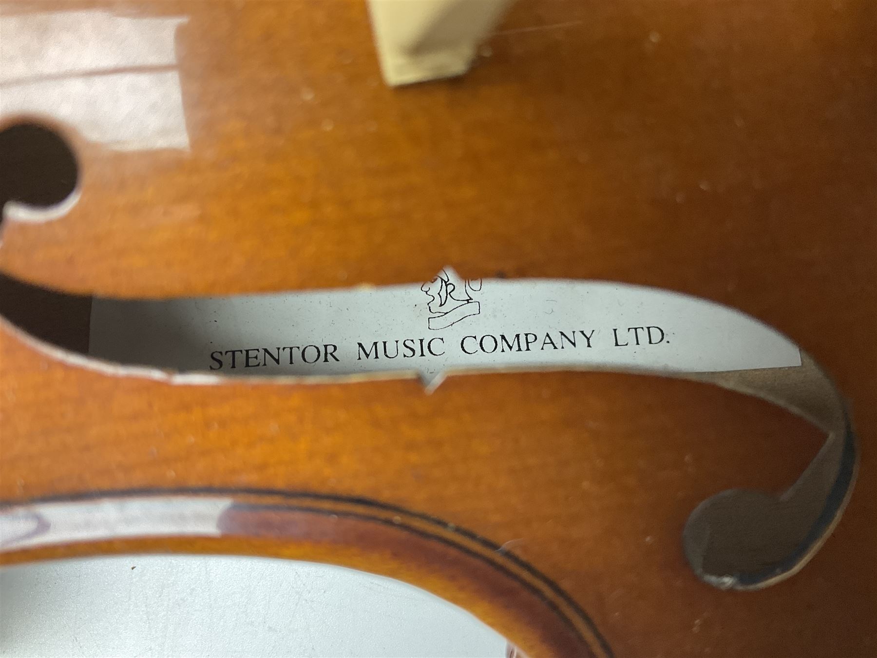 Three Stentor Student violins - three-quarter size with 33cm two-piece back; and two quarter size each with 28cm two-piece back; each in carrying case with bow (3)