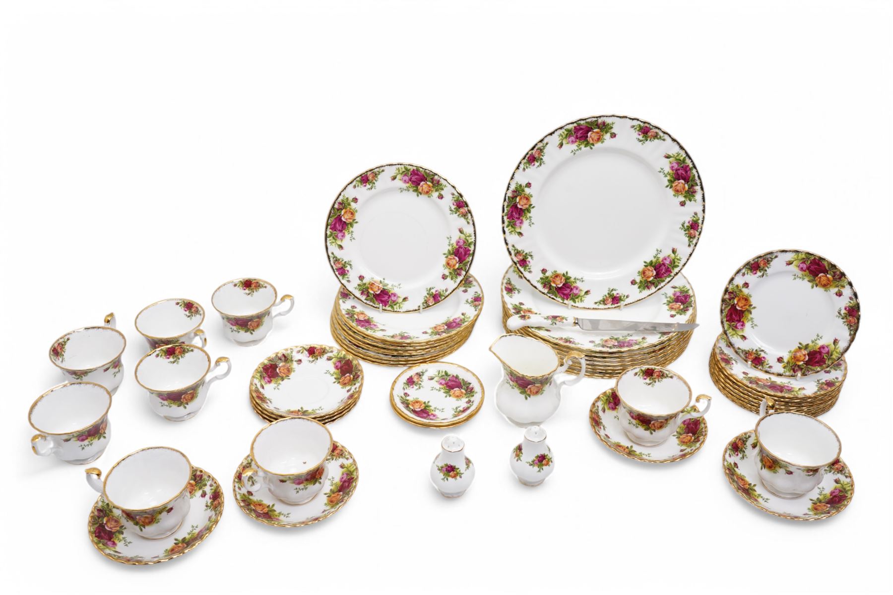  Royal Albert Old Country Roses tea and dinner service comprising nine dinner plates, nine dessert plates, nine cups, eight saucers, milk jug, salt and pepper, bread knife and two saucer dishes