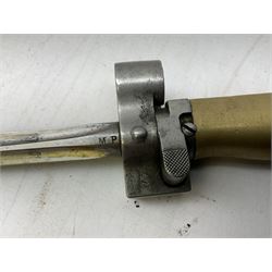 French Lebel Model 1886/93/16 bayonet with 52cm steel cruciform blade and brass hilt No.R22136; in steel tapering round scabbard numbered A62918 L65.5cm overall