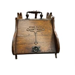 Early 20th century oak fall front coal scuttle, shaped uprights, hinged lid carved with scrolled decoration, with companion coal shovel