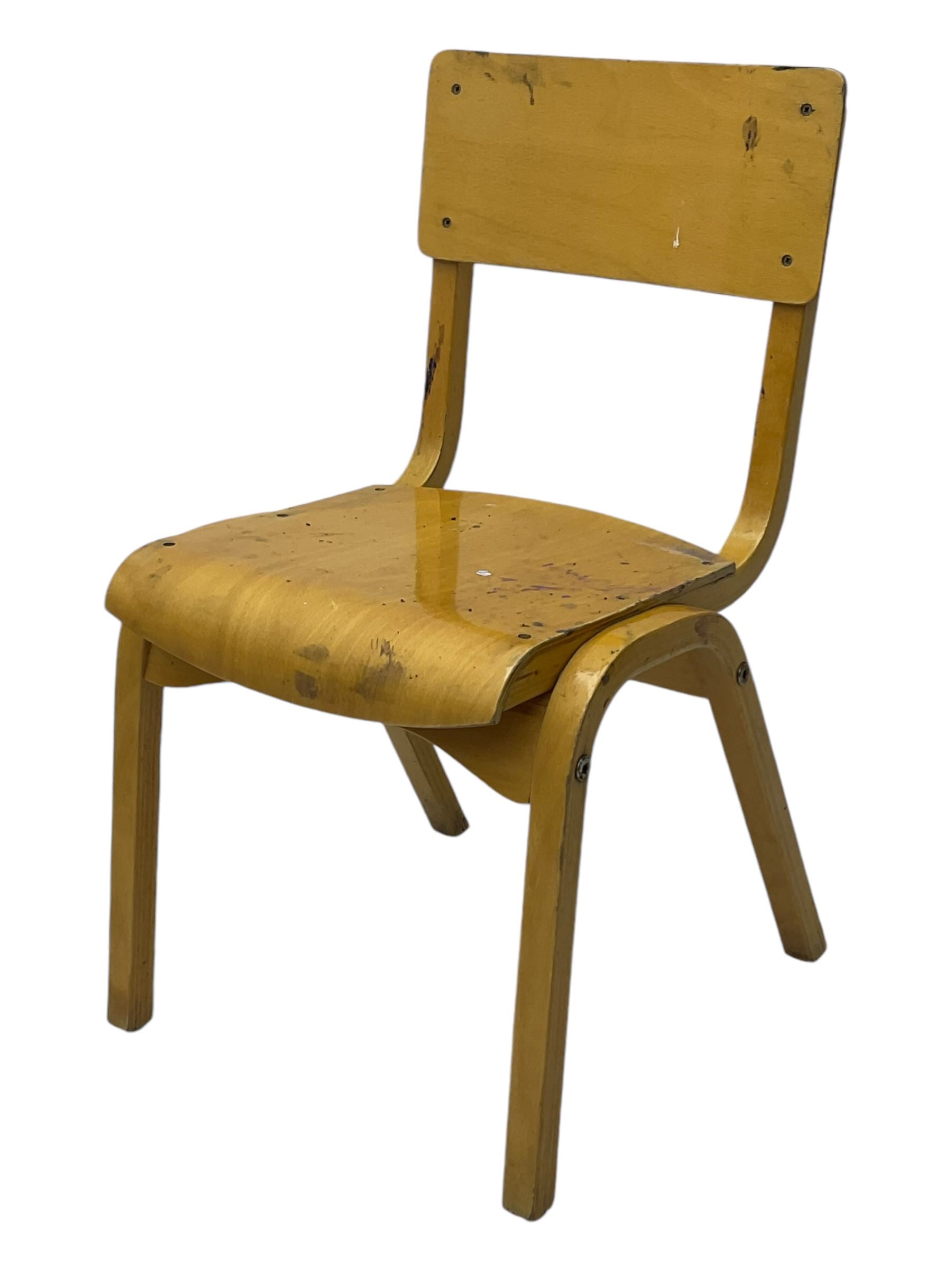 Mid-20th century beechwood school desk, rectangular lift-top desk with storage compartment, supported by square legs with cross stretchers; four matching beech chairs (5)