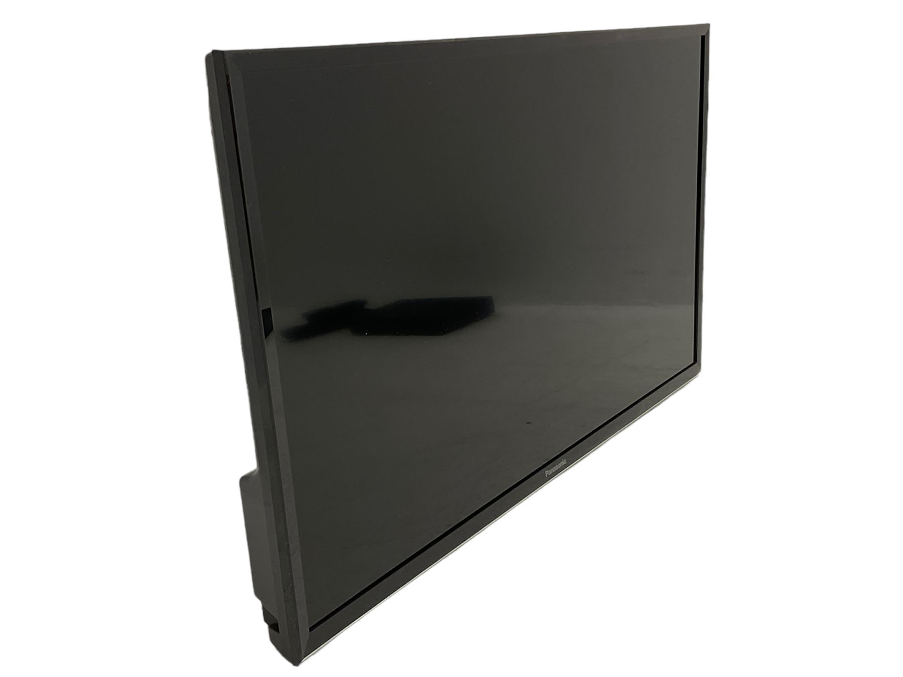 Panasonic 32 inch TV with DVD player and wall bracket and CD rack including various CDs 