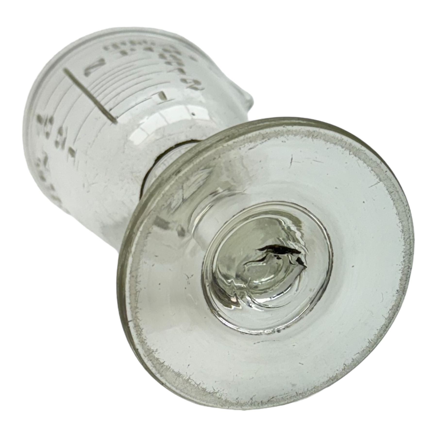 Five 19th century penny lick glasses, together with a pair of 19th century cut glass open salts with lemon squeezer bases, and a 19th century glass measure, largest example H12cm