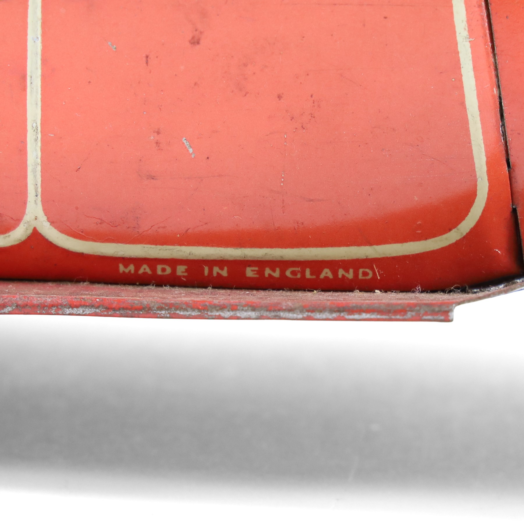 Mettoy tinplate clockwork Citroen saloon car, red orange body with cream roof and windows, with driver, Dunlop tyres and key, H9cm, L26cm