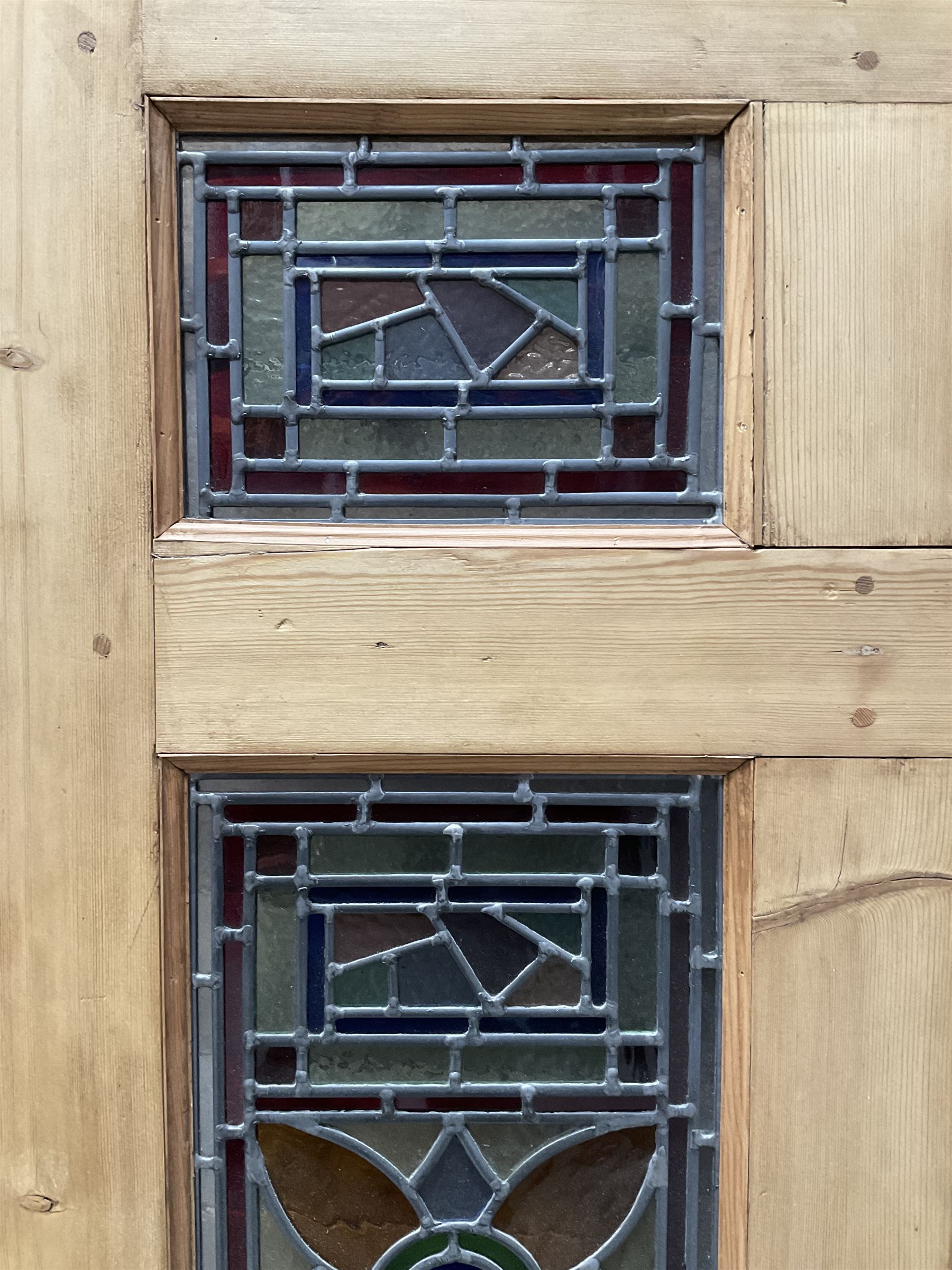 Early 20th century pine six panel door with later stained glass panels
