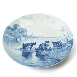 Continental figural group of two owls, possibly by Ernst Bohne & Söhne, modelled in a naturalistic setting, H25cm; together with a model delft charger (2)