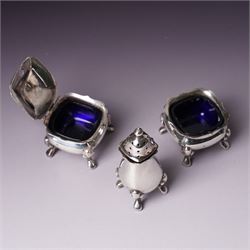 Pair of silver navette shape salts , cased Birmingham 1900 Maker Mitchell Bosley & Co., silver three piece condiment set, pair of silver cornucopia shape salts, silver upright photograph frame 17cm x 13cm and a pair of glass salts with silver rims