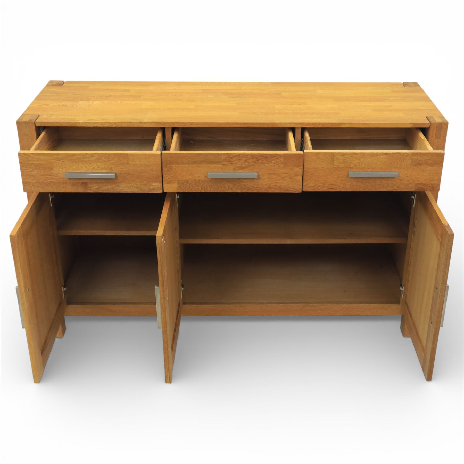 Solid light oak sideboard, fitted with three drawers and three cupboards