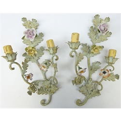  Pair of French patinated metal two branch electric wall sconces, in the form of trailing foliage with ceramic flower heads, H46cm  