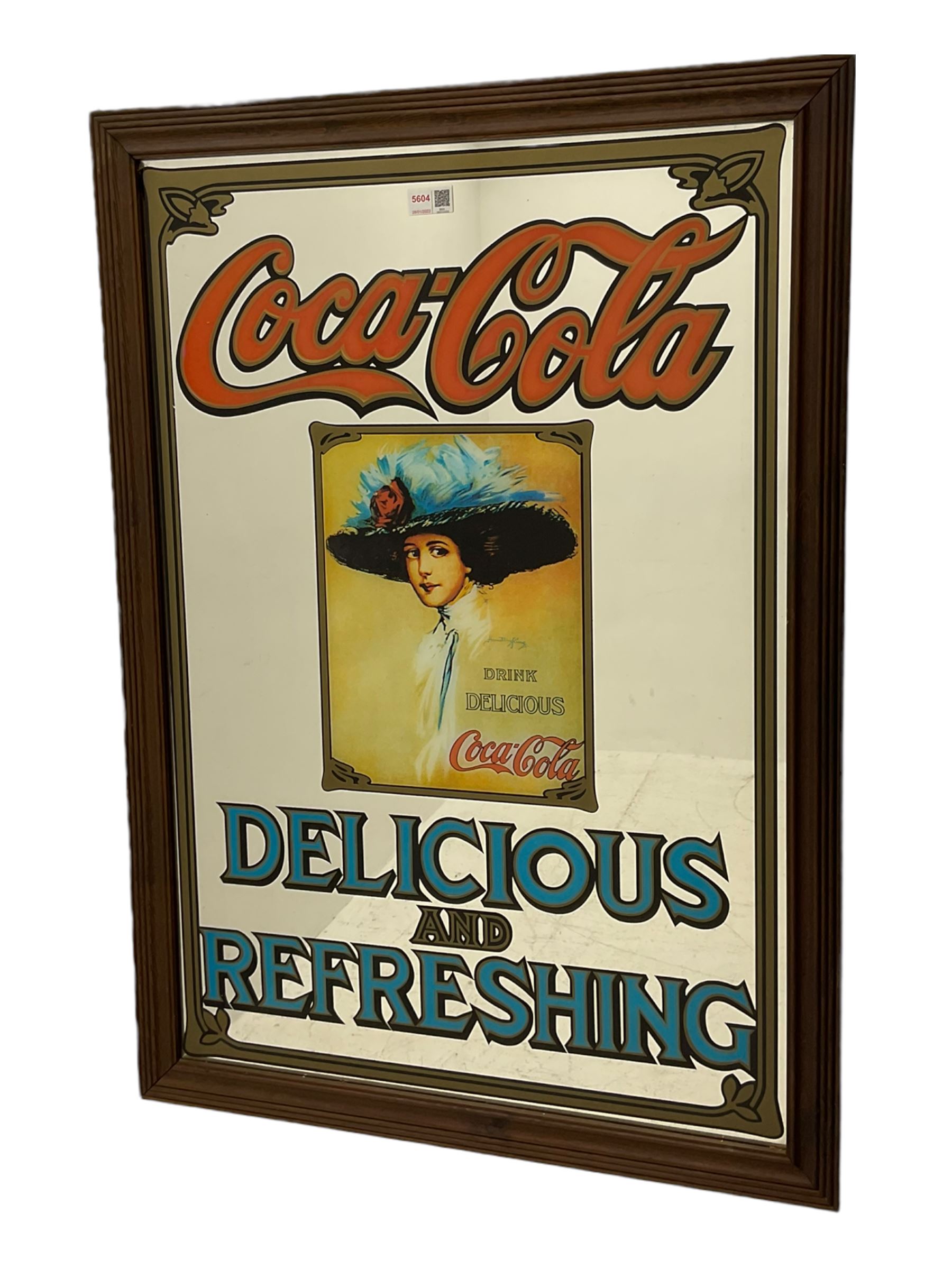Late 20th century 'Coca Cola' style mirror (64cm x 89cm), and a 20th century frameless mirror (44cm x 67cm)