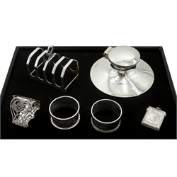 Silver toast rack by Viner's Ltd, London 1932, silver Capstan inkwell, Birmingham 1916,  silver pierced serviette ring and two other silver serviette rings, hallmarked