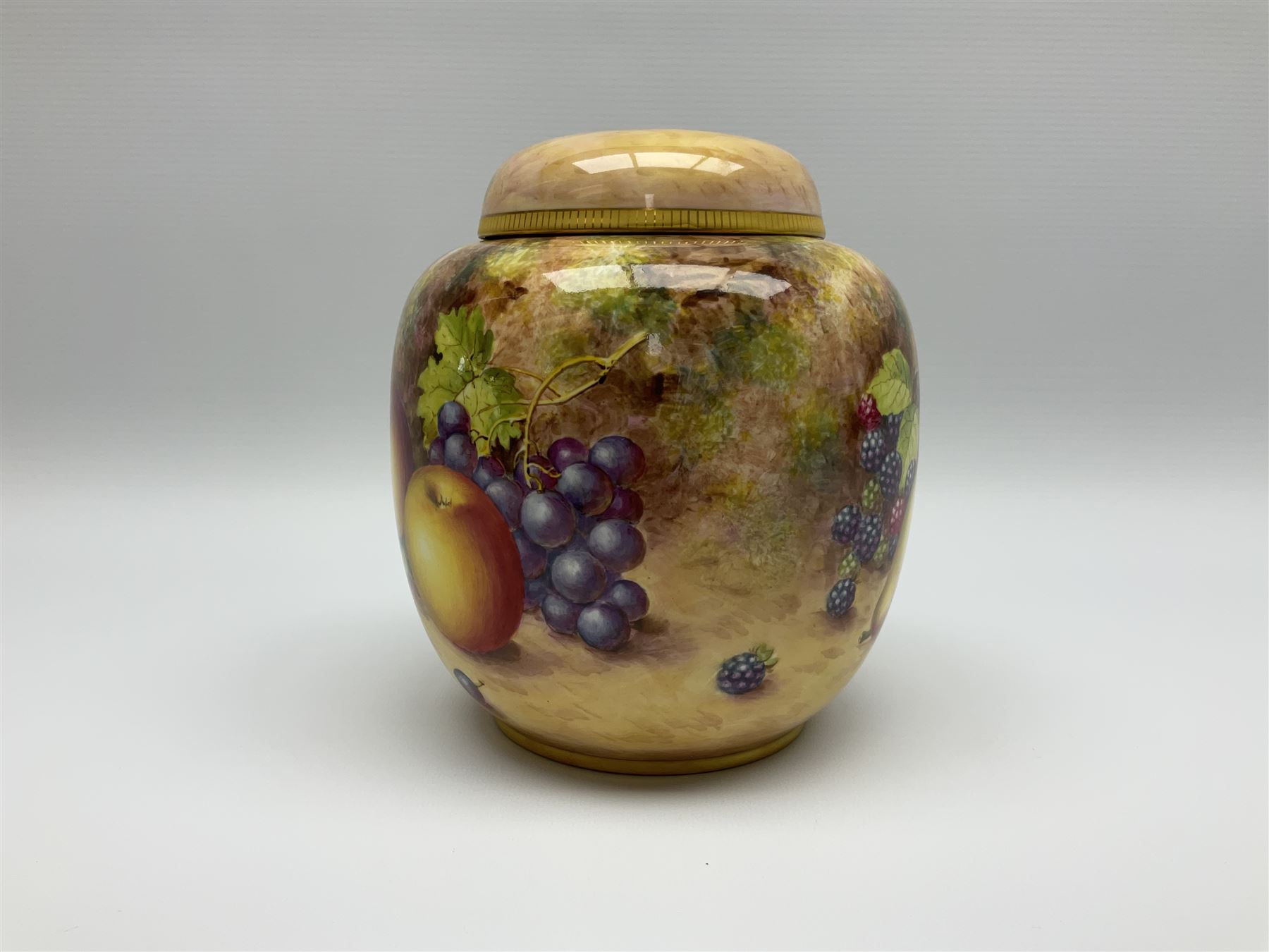 Mid/late 20th century Royal Worcester ginger jar and cover decorated by John Freeman, hand painted with a still life of fruit upon a mossy ground, signed Freeman, with black printed mark beneath and painted shape number 2826, H17.5cm