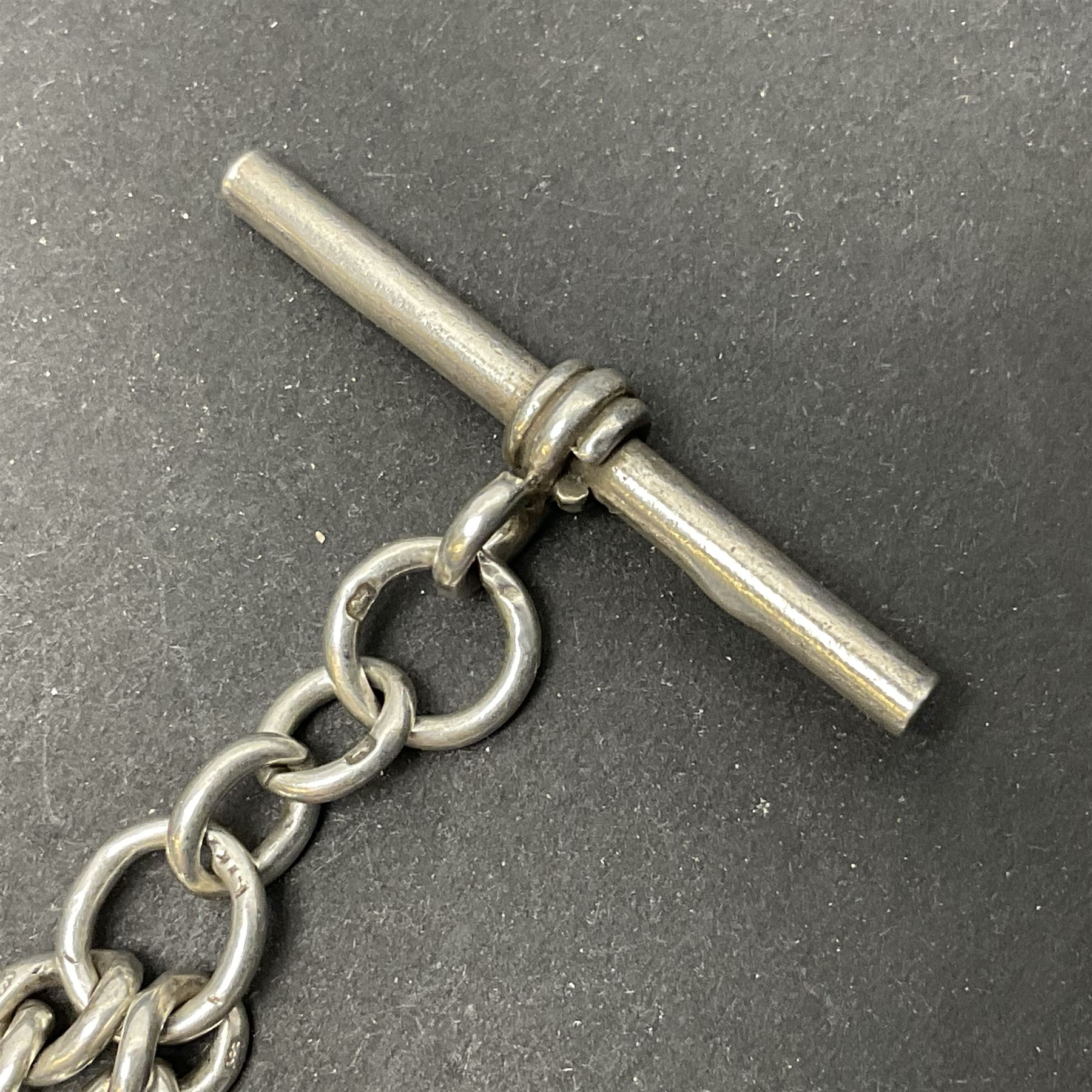 Early 20th century silver tapering Albert chain, hallmarked to T bar and clips, with lion passant stamped on each link