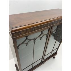 Early 20th century mahogany display cabinet, four adjustable shelves, raised on cabriole supports and ball and claw feet