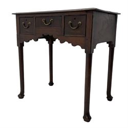 18th century oak low-boy, ovolo-moulded rectangular top over three cock-beaded drawers, circular brass handle plates and D-shaped handles, shaped and stepped arched apron, on cabriole supports 