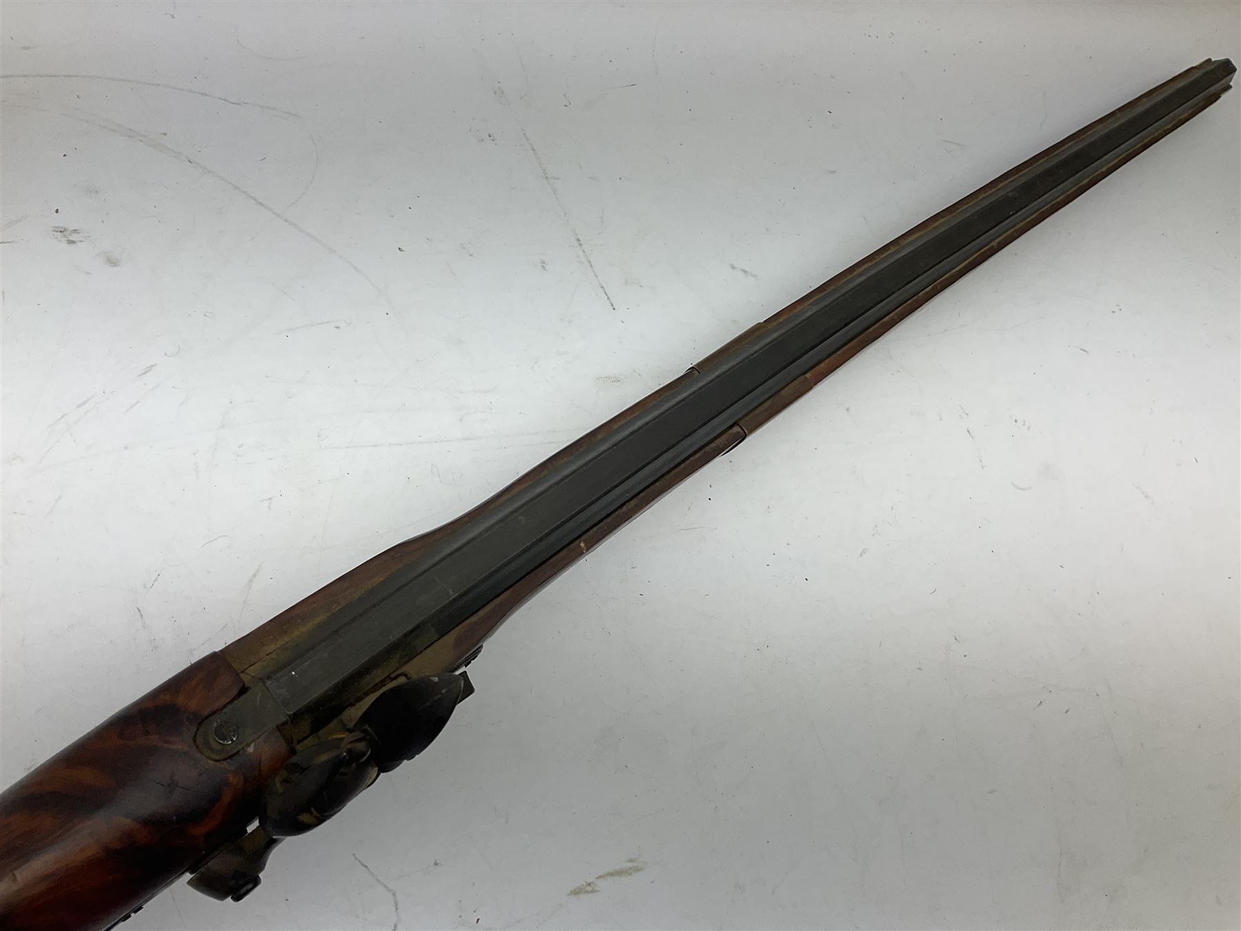 Reproduction non-firing Kentucky style flintlock musket musket, the 87.5cm hexagonal barrel with ramrod under, brass and brassed furniture and patch box to walnut stock L131cm overall