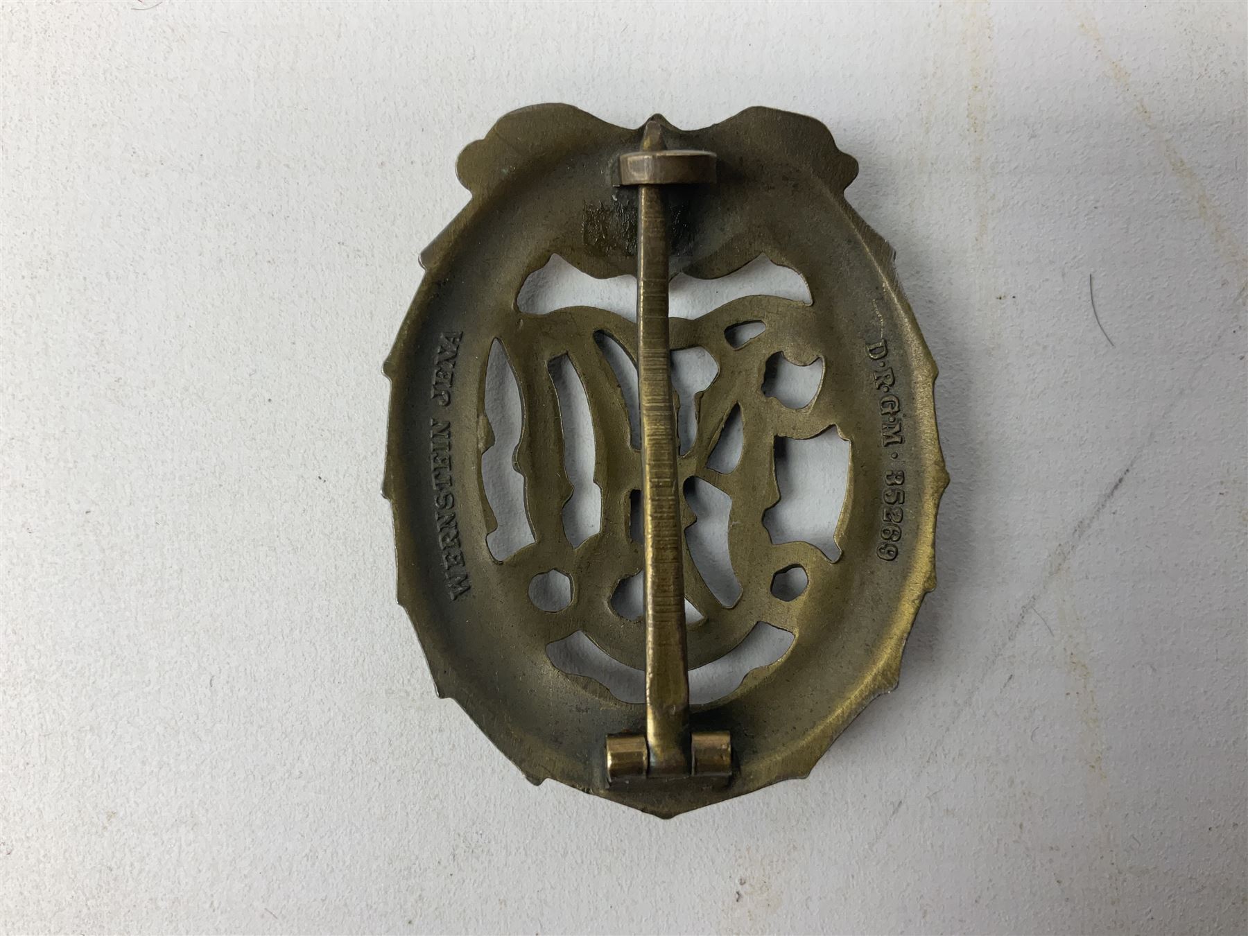 Two WW2 German Sports badges - SA sports badge marked verso 'W.Redo Eigentum D. Obersten SA. Fuhrung Saar Lautern'; and DRL sports badge marked verso 'Wernstein Jena D.R.G.M. 35269' (2)