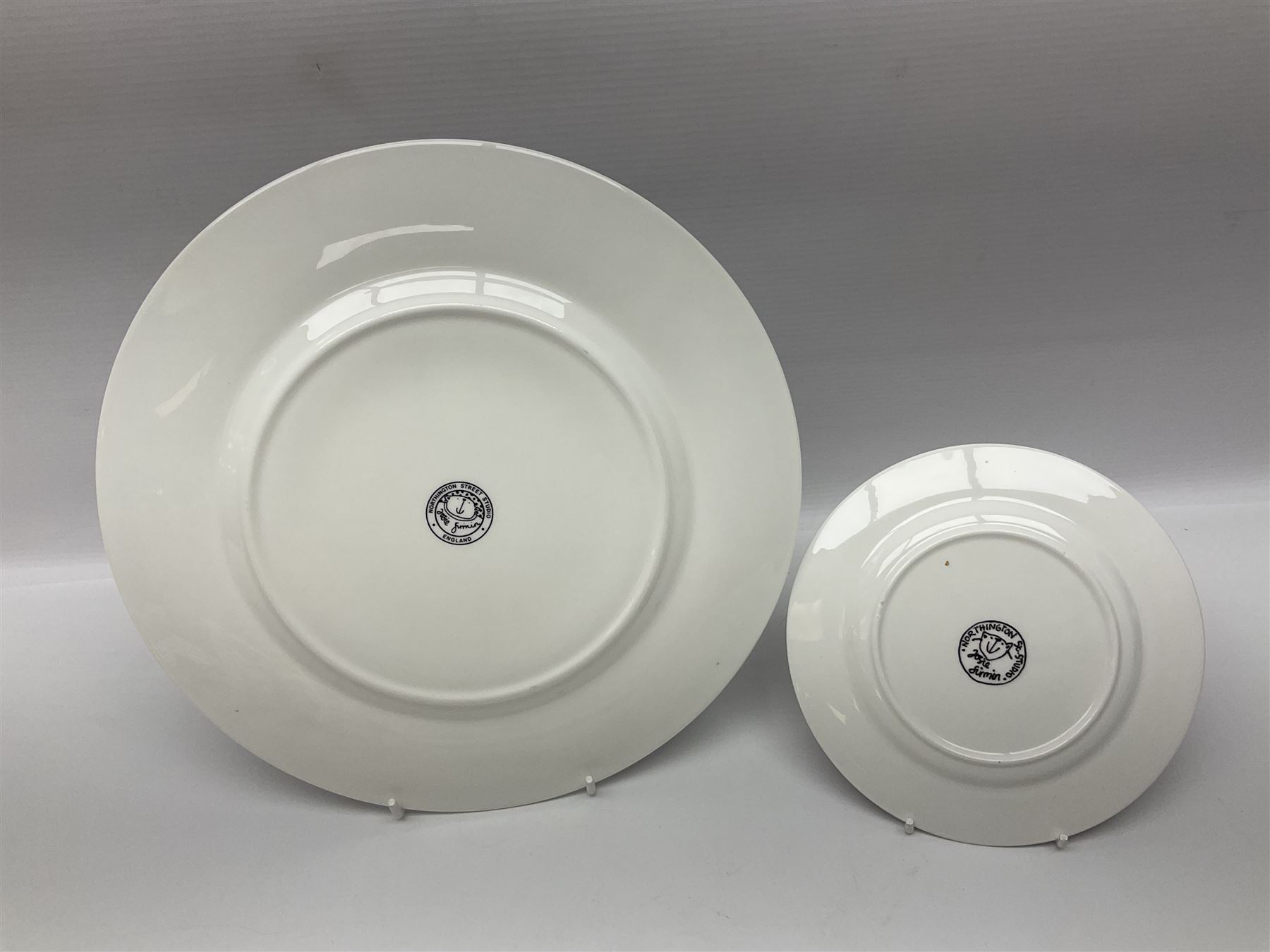 Modern studio pottery by Josie Firmin, to include cup and saucer, three espresso cups and saucers, pair of egg cups etc, each hand painted with varying cartoon cat designs